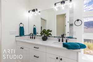 Primary Bathroom featuring double vanity