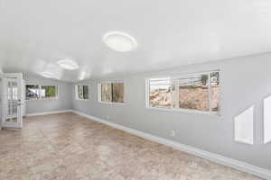 Empty room featuring baseboards