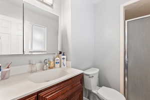 Bathroom with vanity and a shower stall