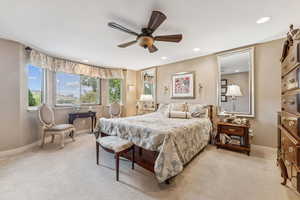 Bedroom featuring light carpet, a ceiling fan, and recessed lighting