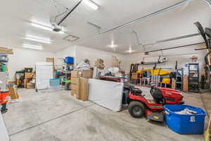Garage featuring a garage door opener