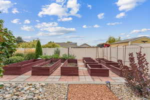 View of patio featuring a vegetable garden