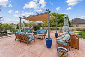 Fenced backyard featuring an outdoor living space with a fire pit, a patio, and a pergola