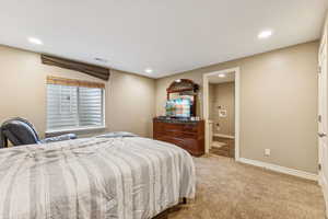 Bedroom with carpet floors and recessed lighting