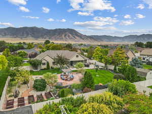 Aerial perspective of suburban area featuring a mountain backdrop