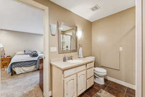 Ensuite bathroom with vanity and a shower