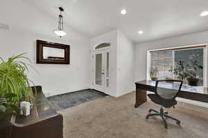 Office space featuring vaulted ceiling, carpet, recessed lighting.
