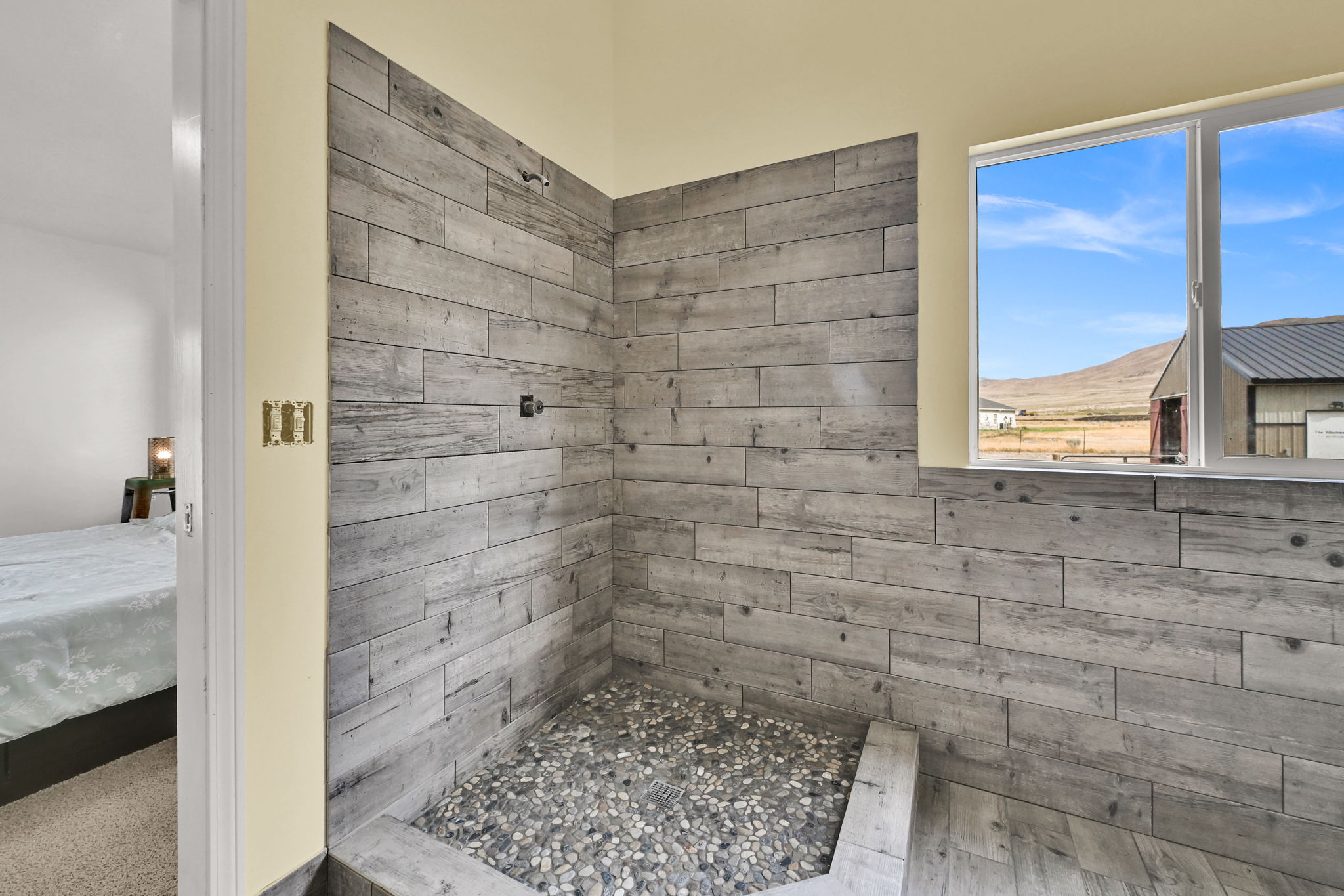 Master Bedroom Bathroom is complete. The bathroom has white cabinets and duel sings