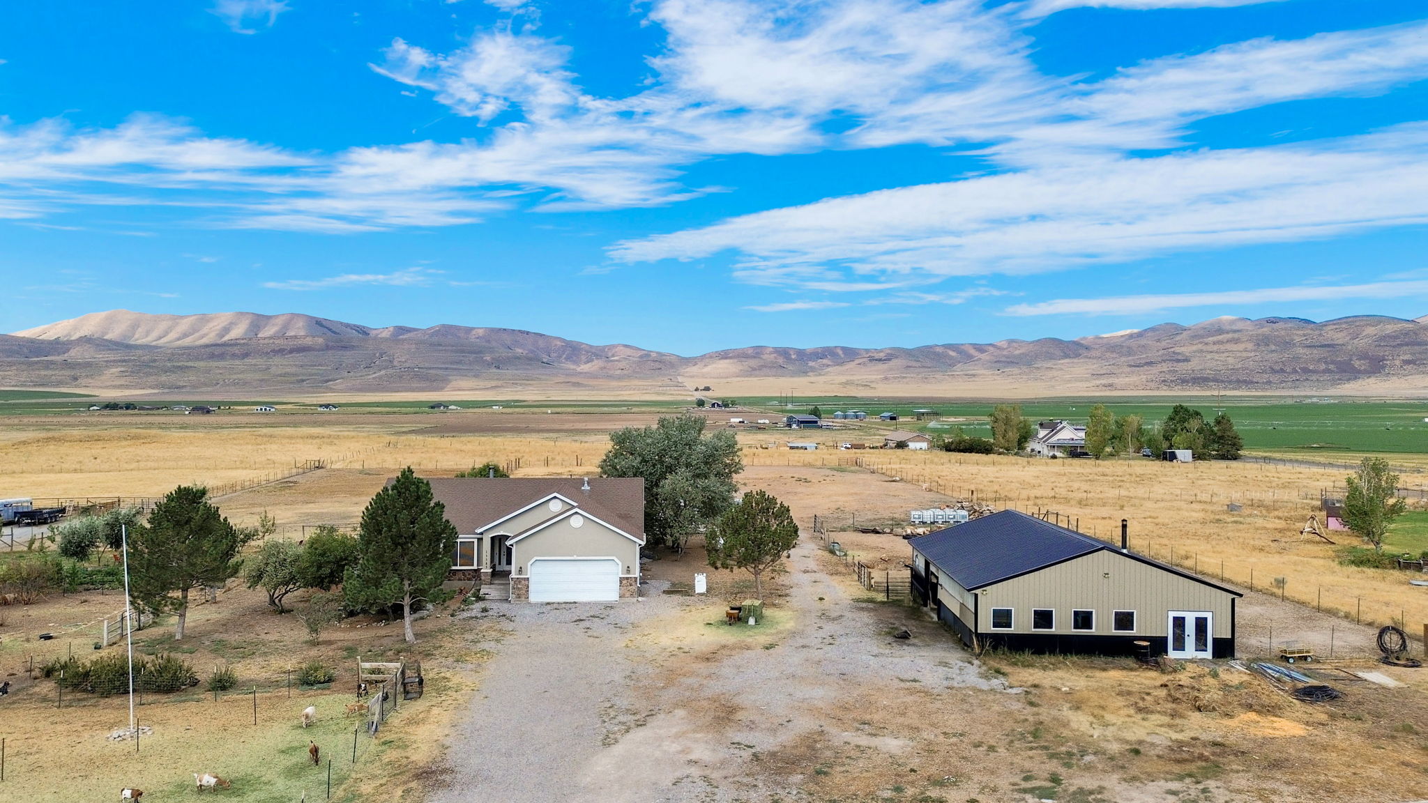 View of mountain backdrop featuring rural landscape
