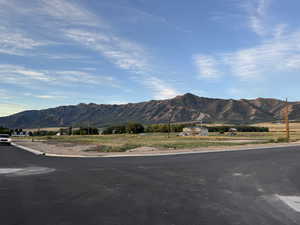 View of mountain backdrop featuring rural landscape