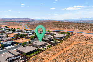 Aerial view of residential area featuring a mountainous background