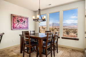 Dining space featuring a mountain view and a chandelier