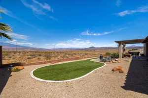 View of yard with a mountain view and a patio