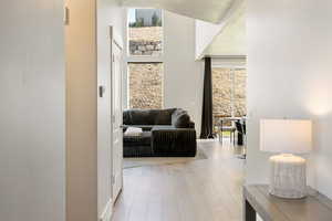 Hallway with light wood finished floors