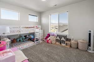 Carpeted bedroom featuring a mountain view