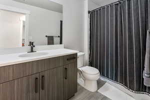 Bathroom featuring vanity and light wood finished floors