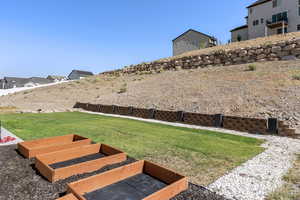 View of green lawn featuring a residential view
