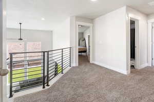 Corridor featuring carpet and recessed lighting