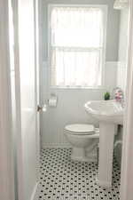 3/4 Bathroom featuring a wainscoted wall