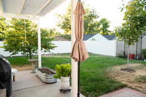 Large Fenced Backyard with a Pergola and a patio area. Perfect for Entertaining!