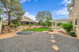 View of yard featuring a patio and a pergola