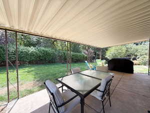 View of patio / terrace with outdoor dining space and a grill