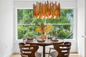Dining space featuring light wood finished floors and baseboards