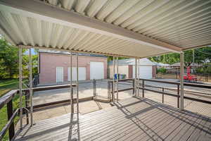Covered deck, fenced back yard, with an extra-wide, extra-deep detached garage