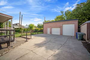 View of driveway and detached garage