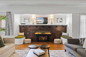 Living room featuring wood finished floors and a gas fireplace