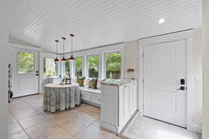 Sunroom with backyard and deck access