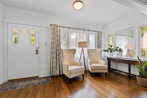 Front entry with wood floors and stained glass windows