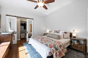 Primary bedroom with a walk in closet, and ensuite bath