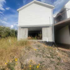 View of property exterior featuring a balcony