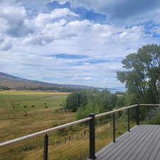 View of mountain background featuring rural landscape