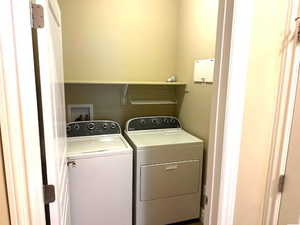 Washroom with washing machine and dryer