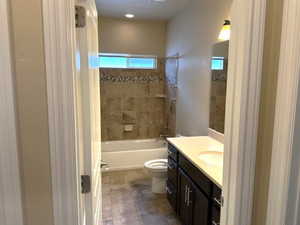 Bathroom featuring shower / tub combination and vanity