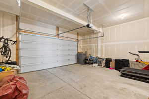Garage featuring a garage door opener