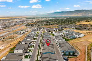 Aerial view of residential area featuring a mountainous background