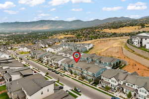 Aerial view of residential area featuring mountains