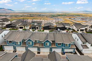 Aerial view of residential area with a mountain backdrop