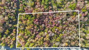 Aerial overview of property's location with property parcel outlined