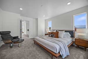 Carpeted bedroom with baseboards and recessed lighting