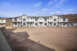 View of front of house featuring stucco siding