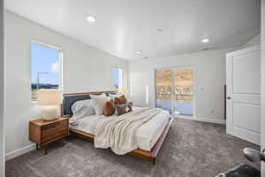 Bedroom with carpet floors, access to outside, and recessed lighting