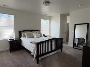 Master Bedroom featuring carpet floors and a textured ceiling