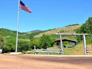 View of property's community featuring a yard