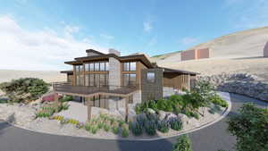 Back of property featuring stone siding, a balcony, and a patio