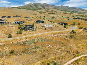 Aerial overview of property's location featuring a mountain backdrop