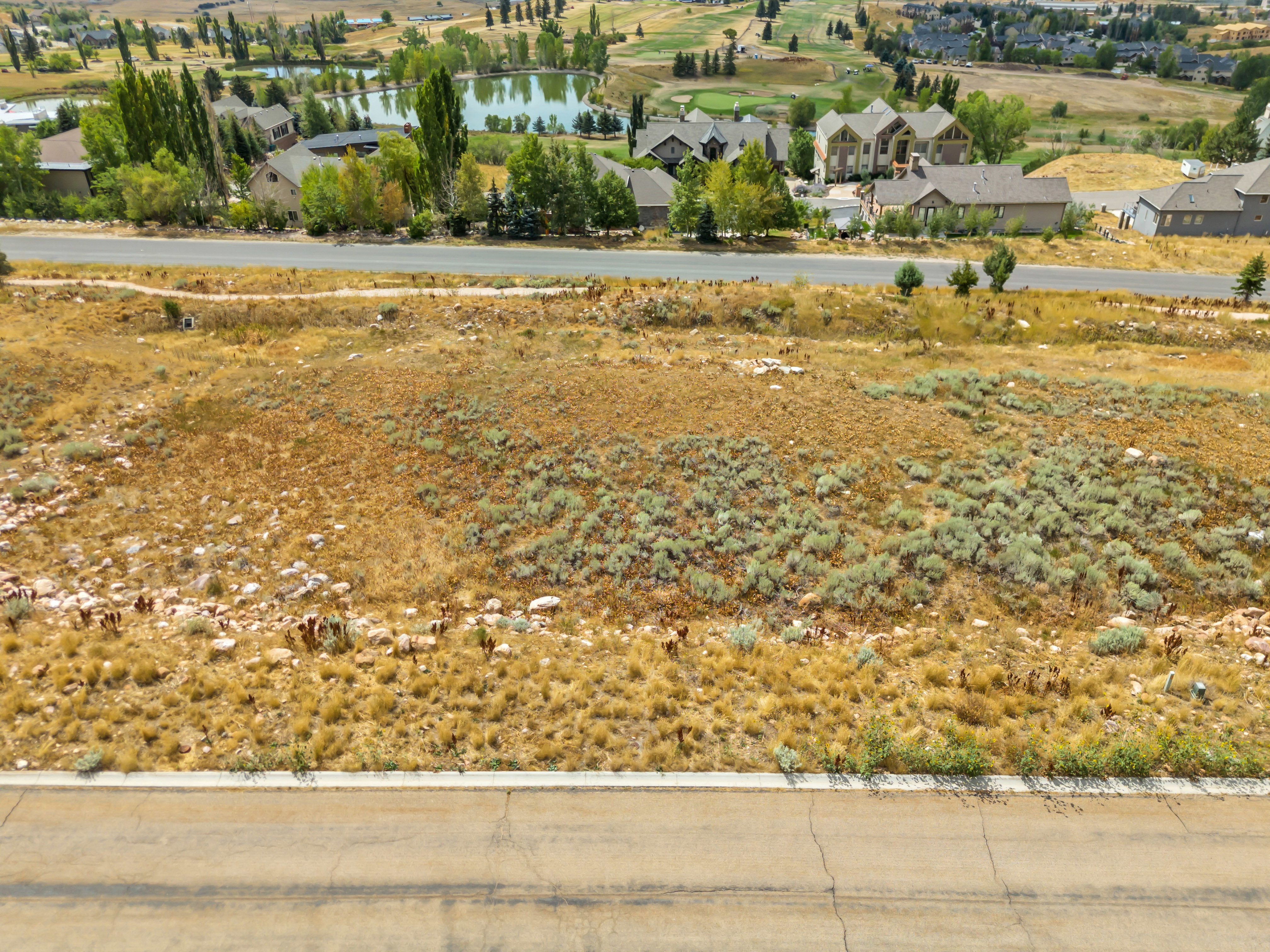 Aerial perspective of suburban area with a large body of water